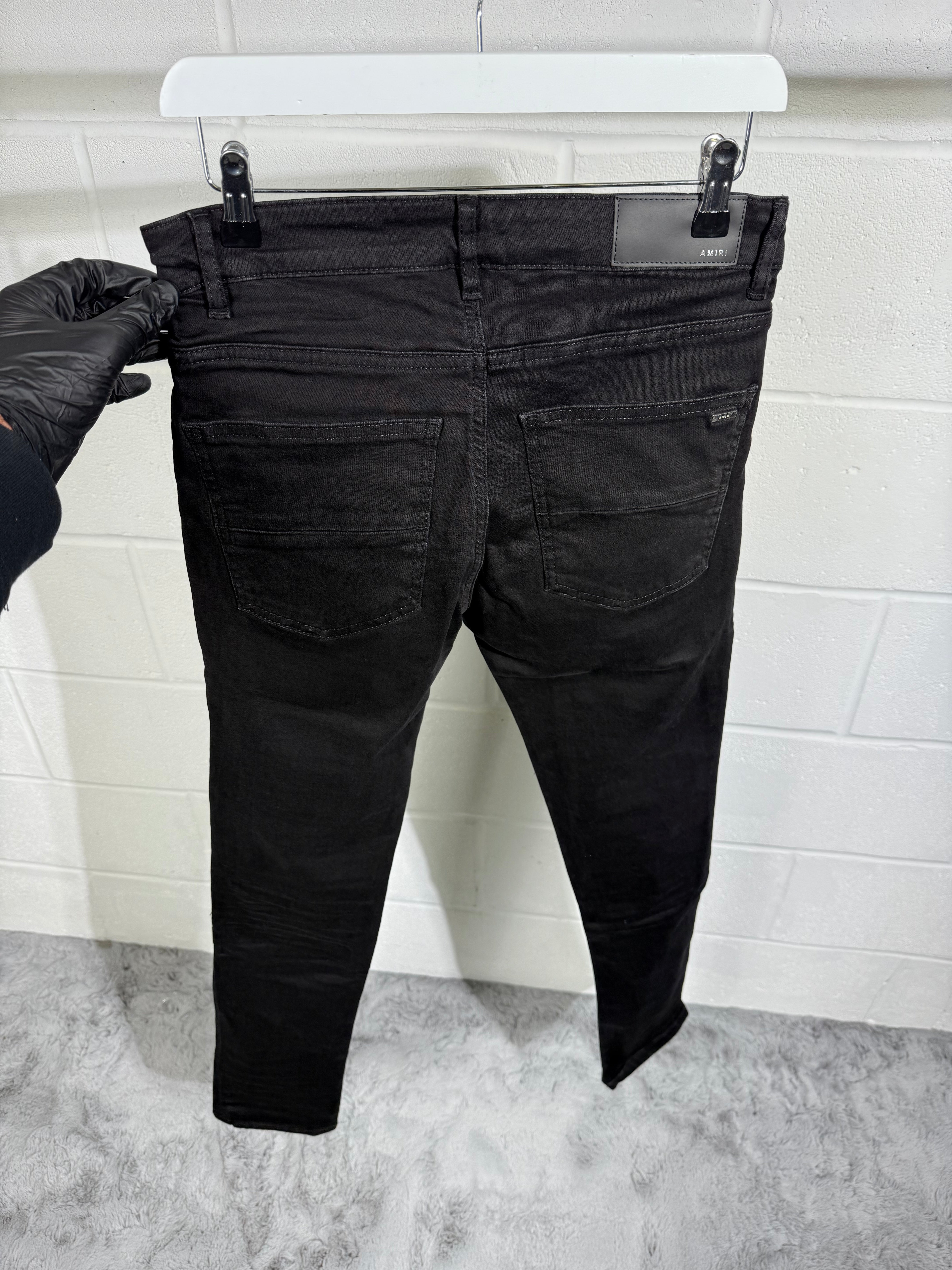 AMIRI RIPPED BLACK JEANS