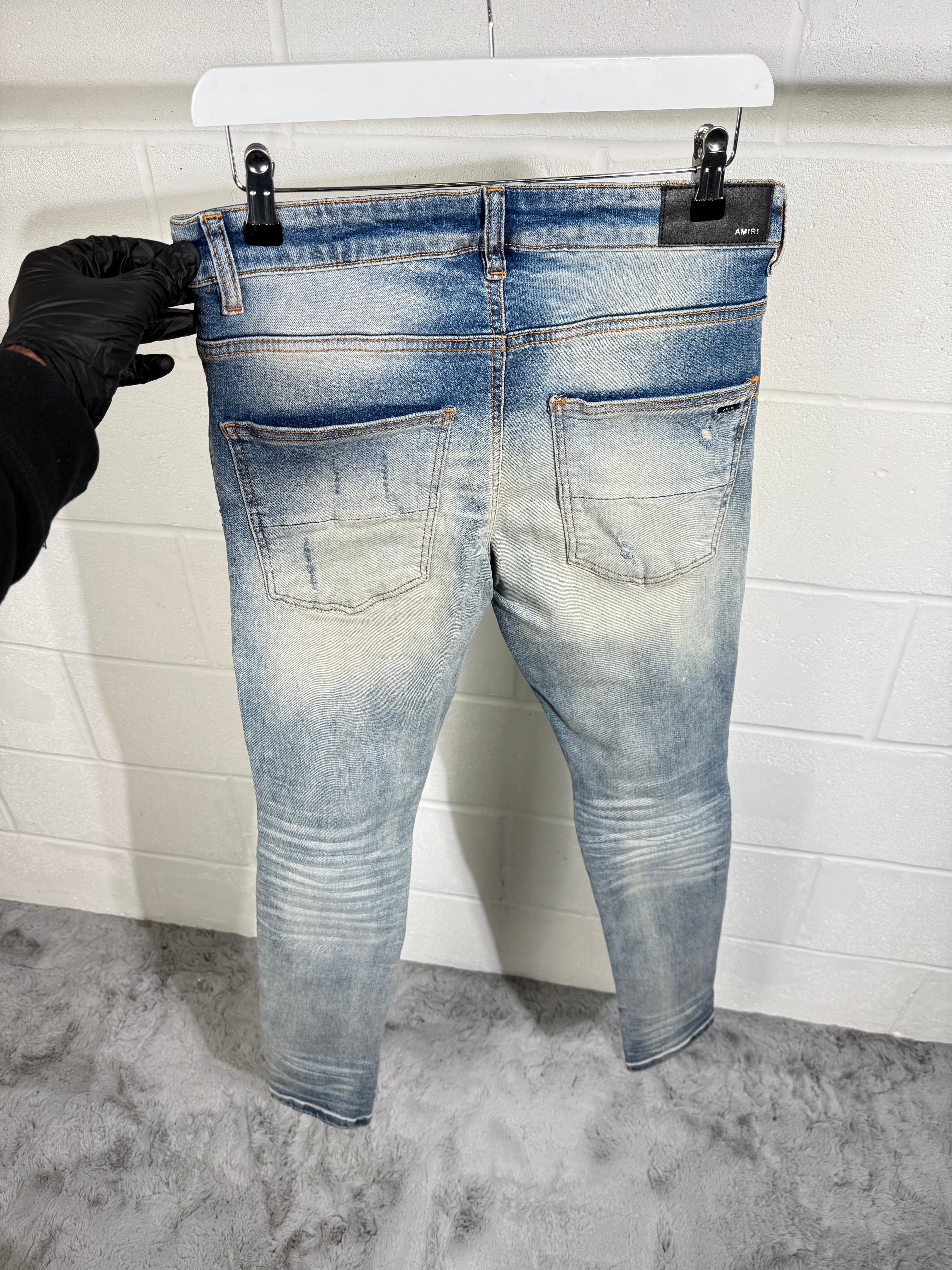 AMIRI RIPPED JEANS LIGHT BLUE
