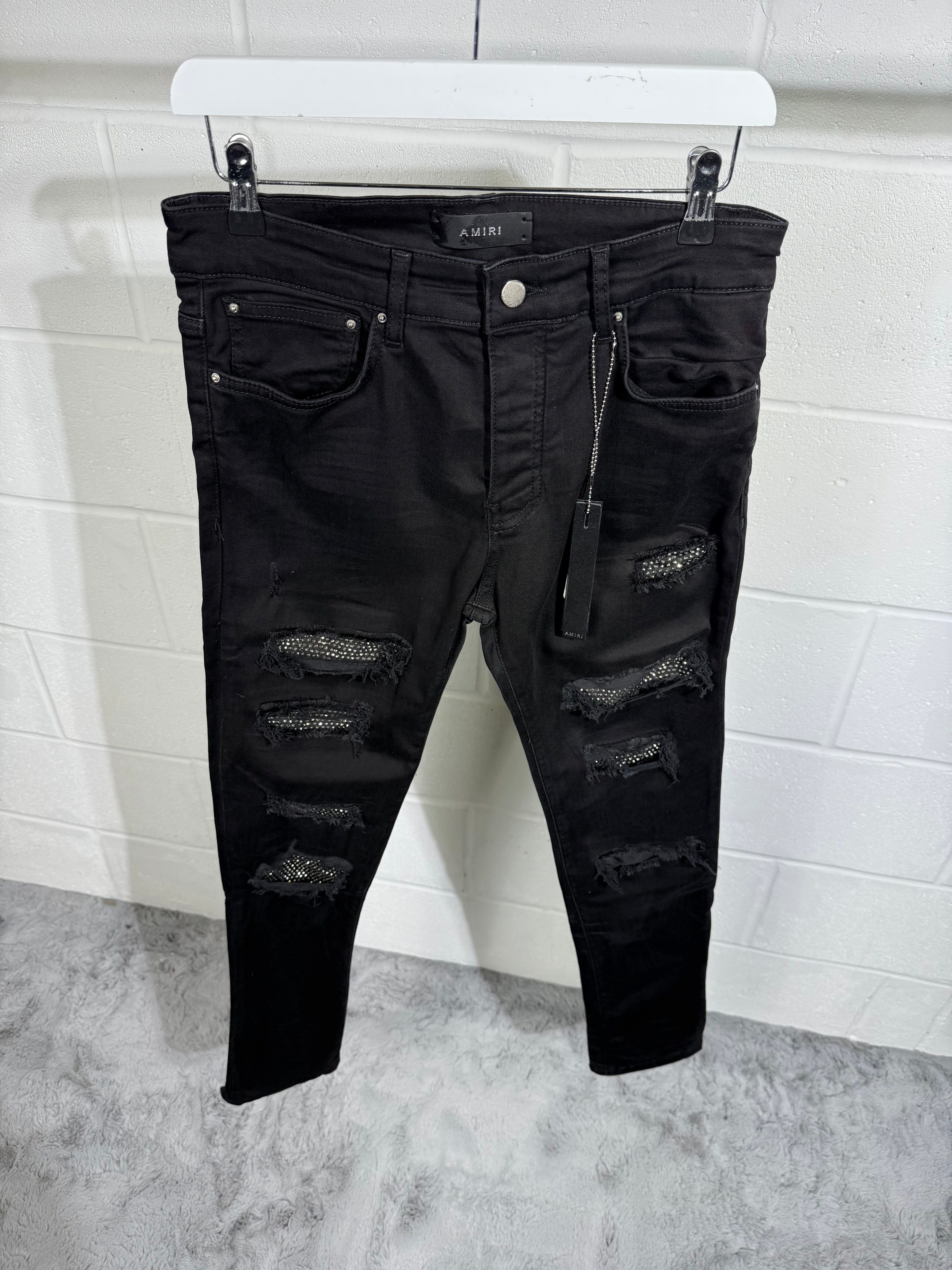AMIRI RIPPED BLACK JEANS
