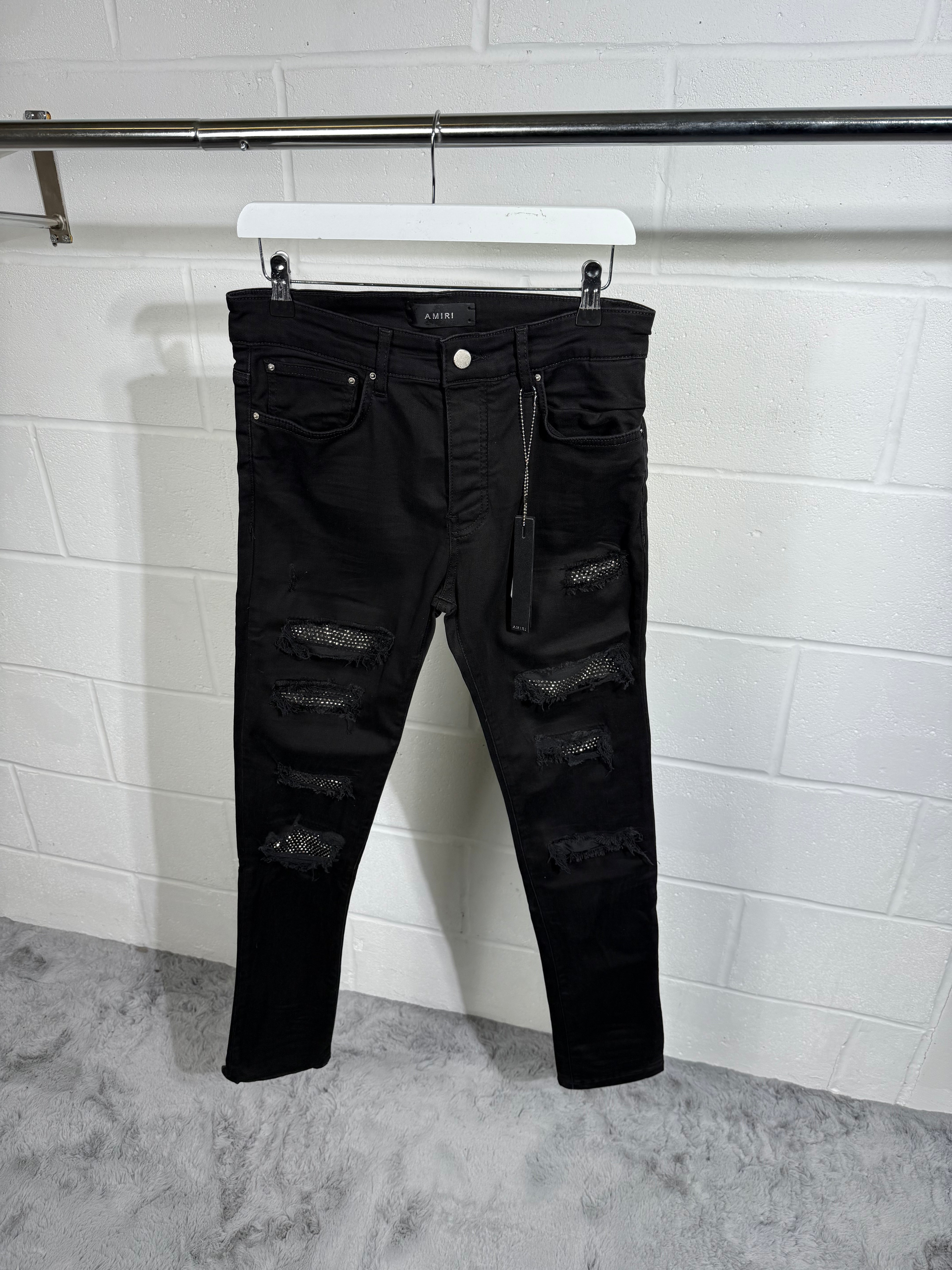 AMIRI RIPPED BLACK JEANS